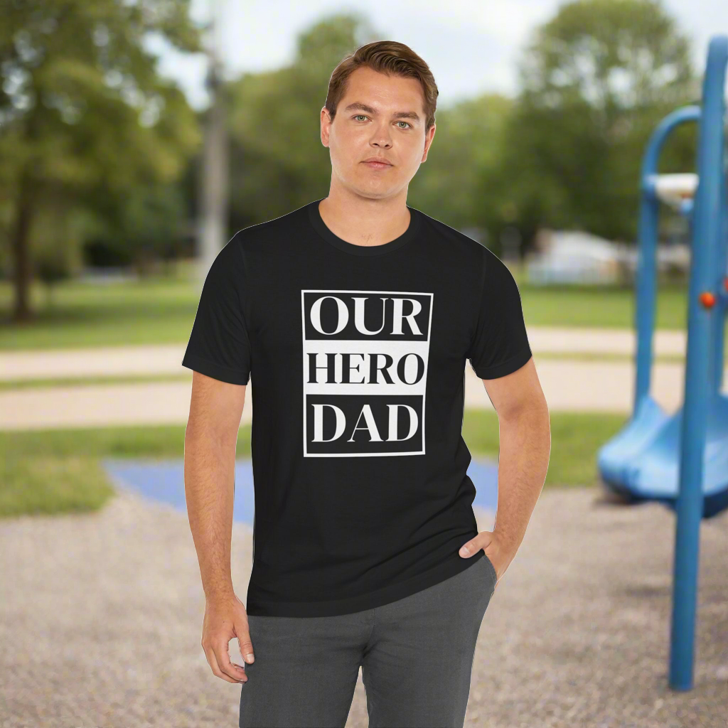 Our Hero Dad T-shirt available in sizes S to 3XL and in three color options.